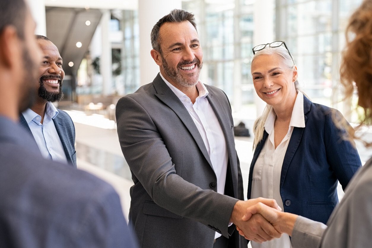 New hire shaking hands with hiring manager