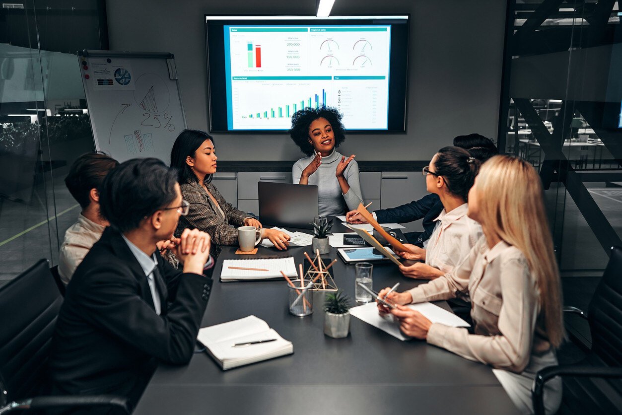 Strategic leader guiding a meeting at the conference table