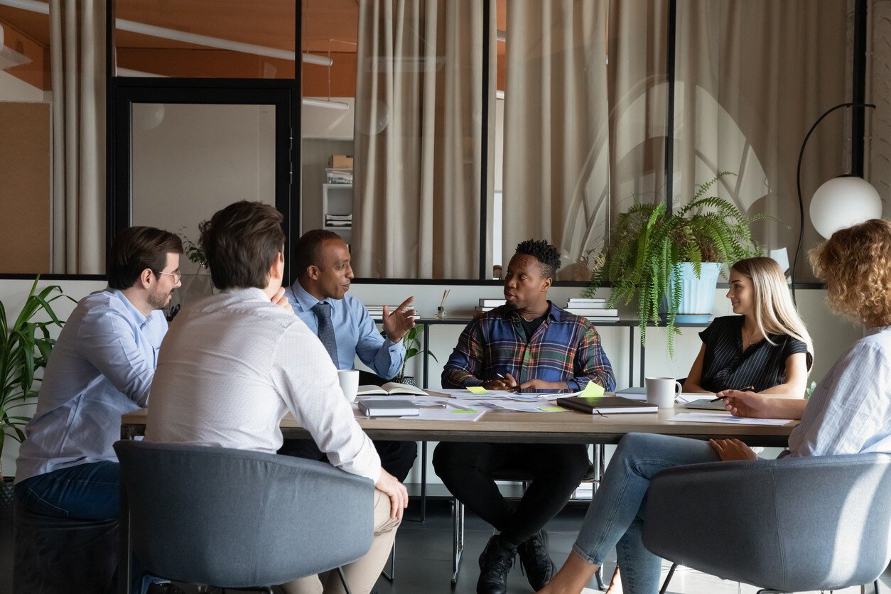 Emotionally intelligent employees having a meeting at a conference table
