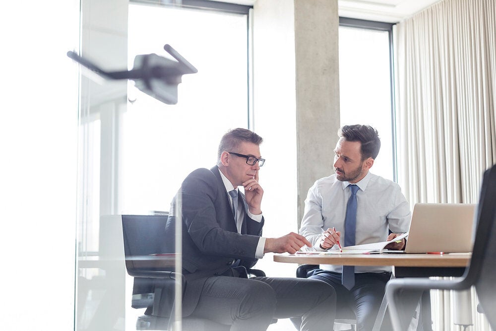 Leader onboarding new hire in the workplace